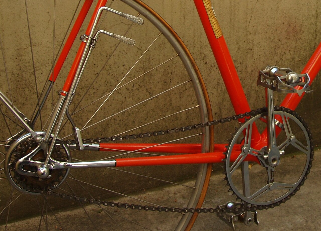 A vintage derailleur and multi-cog gear cluster.
