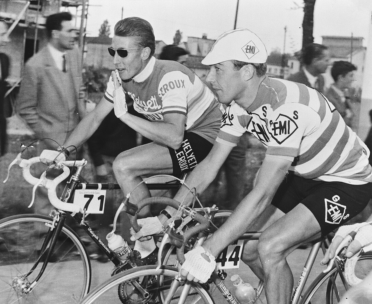 A mid-century road racer pedalling in fluid, even rhythm.